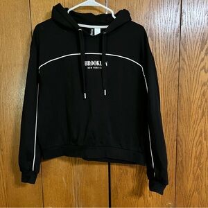 Divided Black Hoodie Sweater with White Accents